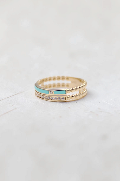 Zafrah 14k solid gold double beaded band ring featuring a turquoise enamel inlay and round clear stones.