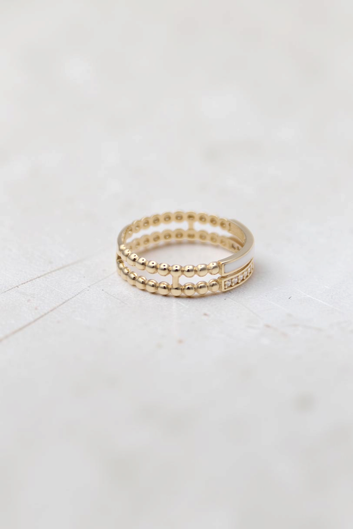 Zafrah 14k solid gold double beaded ring featuring clear stones and a smooth band section, size 7.