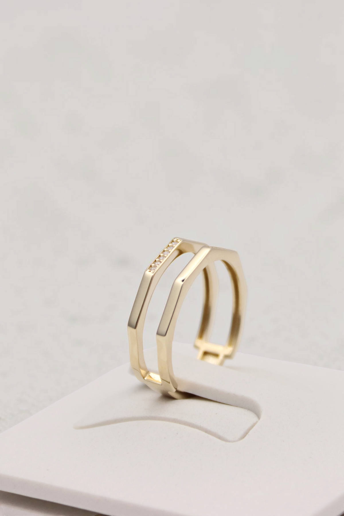 Zafrah double geometric band ring in 14k yellow gold with flat edges and a small row of sparkling accent stones