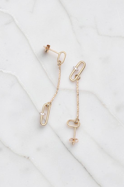 Zafrah 14k solid gold paperclip drop earrings with delicate chain links and small accent stones, 2 inches long.