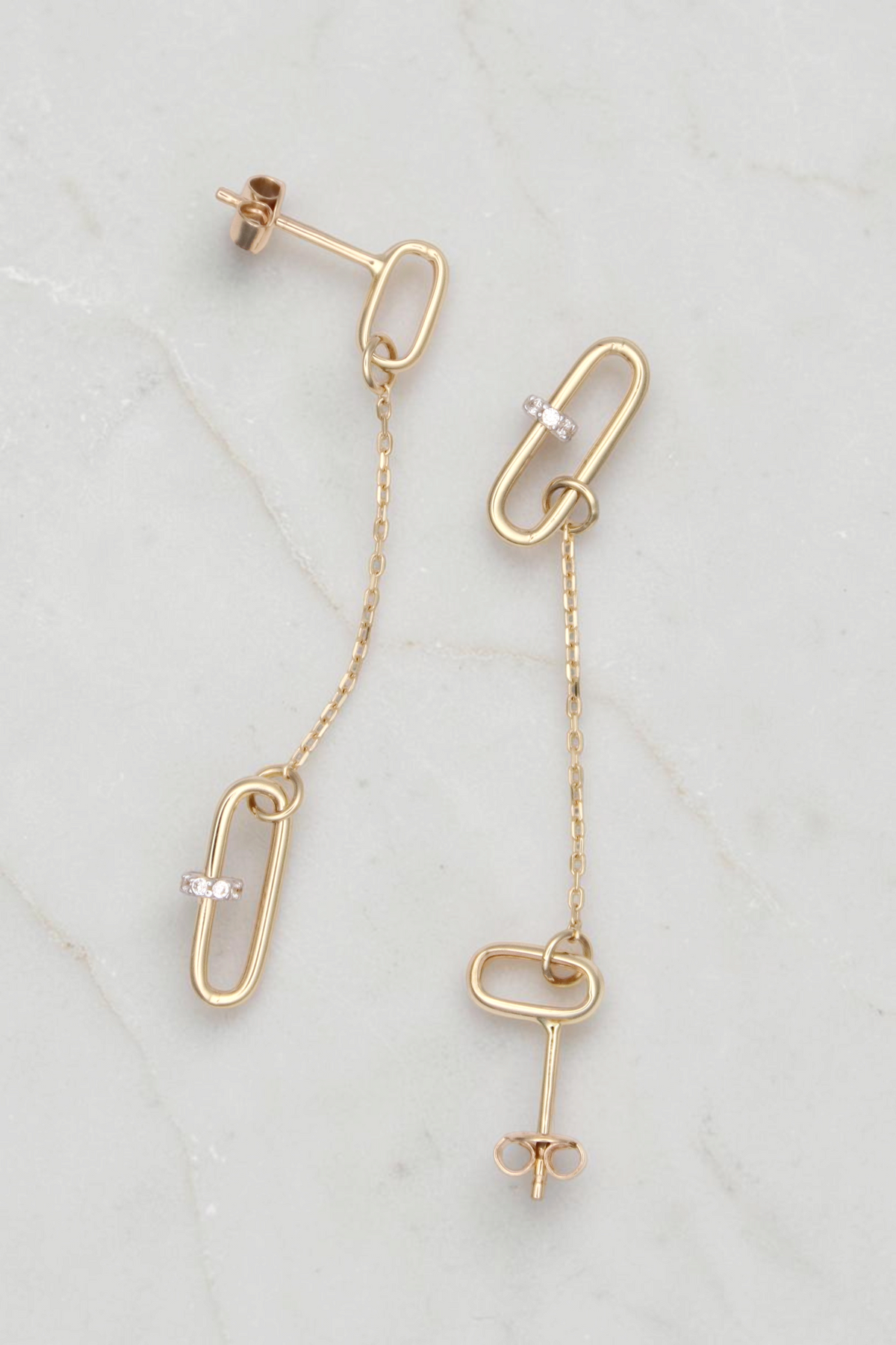 Zafrah 14k solid gold paperclip drop earrings with delicate chain links and small sparkling diamond accents.