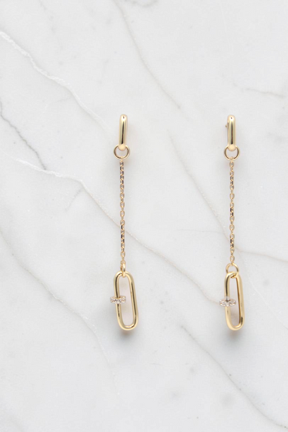 Zafrah 14k solid gold paperclip drop earrings featuring a delicate chain and a small diamond accent on each link.