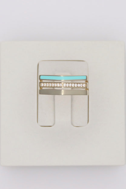 Zafrah 14k solid gold triple line ring featuring a turquoise enamel band, a diamond-set band, and a plain gold band.