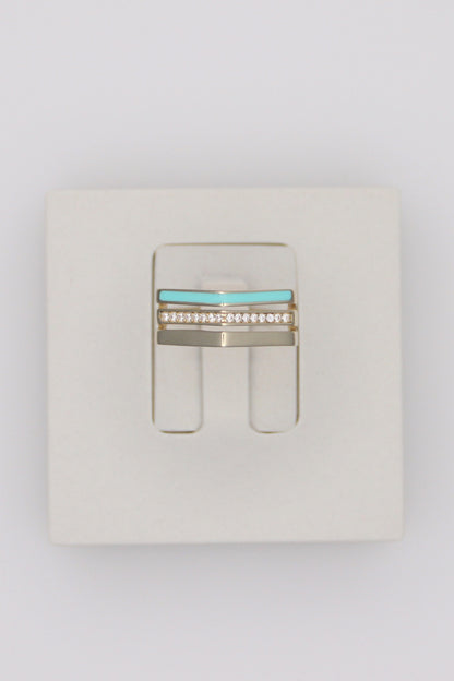 Zafrah triple line ring in 14k solid gold featuring a turquoise enamel band and a row of sparkling diamonds