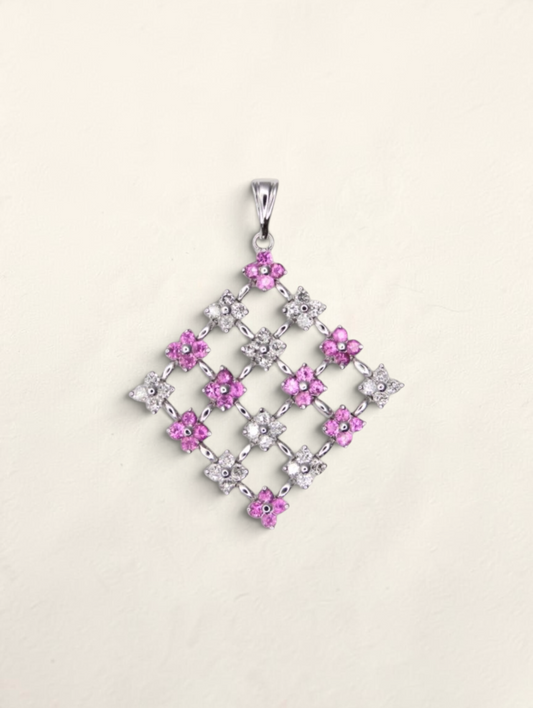 Zafrah 14K white gold mesh pendant featuring round pink sapphires and sparkling diamonds in a diamond-shaped lattice.