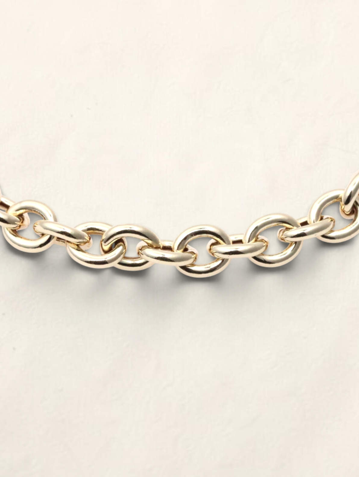 Zafrah 14K yellow gold rolo link bracelet featuring polished round links on a neutral background.