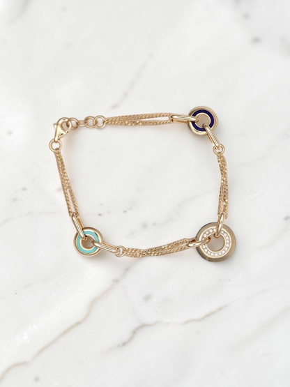 Zafrah 14k solid gold curb chain bracelet featuring turquoise, blue, and CZ stone-accented round and oval links.