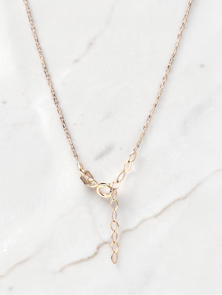 Zafrah 14k yellow gold beaded paperclip necklace with adjustable clasp detail on a white marble background