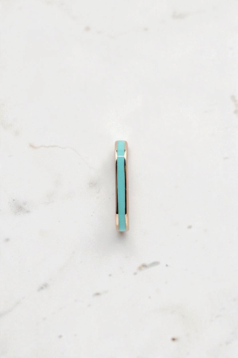 Zafrah dainty rectangular stud earring in 14k solid gold with a vibrant turquoise inlay, side view.