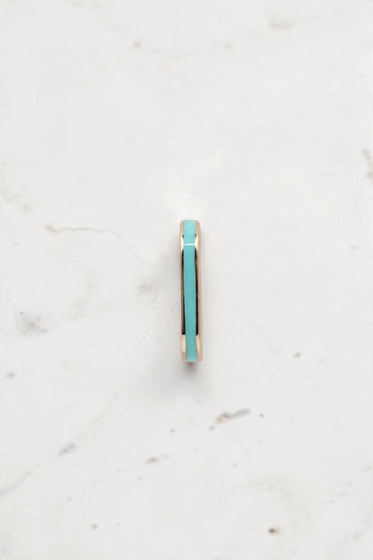 Zafrah dainty rectangular stud earring in 14k solid gold with a vibrant turquoise inlay, side view.