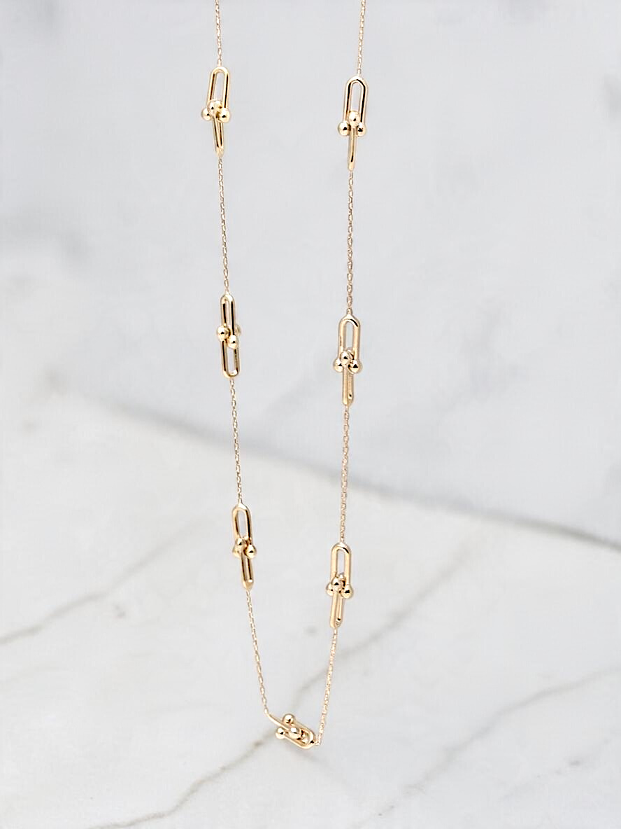 Zafrah 14k yellow gold paperclip necklace featuring delicate beads on a dainty adjustable chain