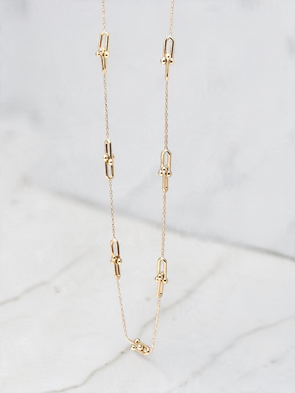 Zafrah 14k yellow gold paperclip necklace featuring delicate beads on a dainty adjustable chain