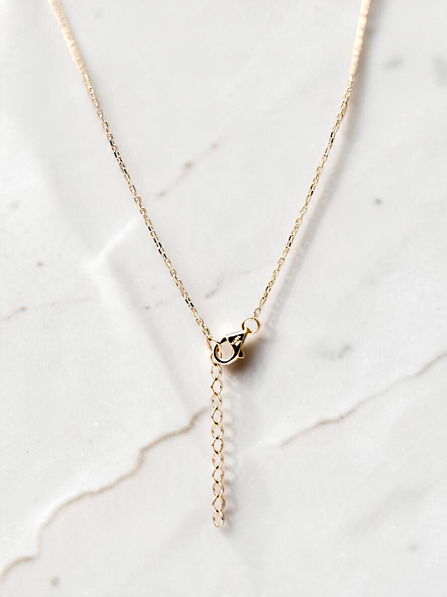 Zafrah 10k yellow gold interlocking heart necklace featuring an adjustable chain with a secure lobster clasp