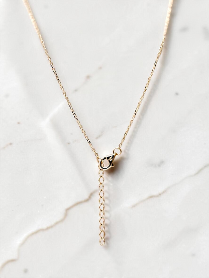 Zafrah 10k yellow gold interlocking heart necklace featuring an adjustable chain with a secure lobster clasp