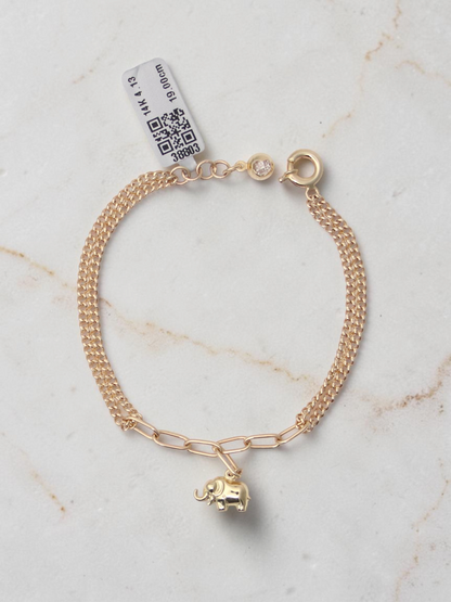 Zafrah 14k yellow gold bracelet featuring an elephant charm on a mixed paperclip and double curb link chain