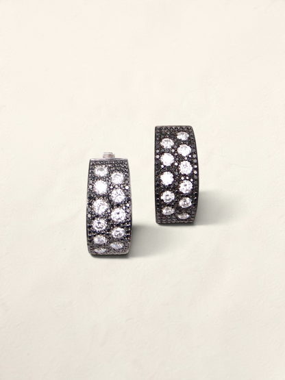 Zafrah 14K white gold huggie hoop earrings featuring a pave setting of round black and white diamonds.