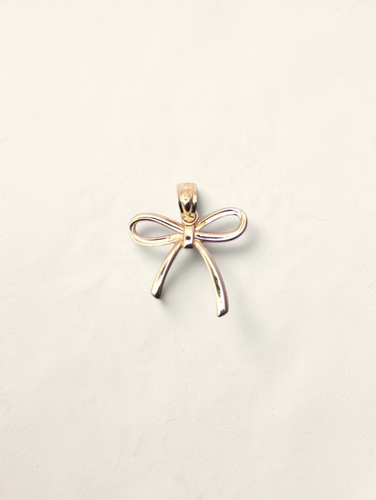 Zafrah 14K yellow gold bow pendant with a polished finish on a neutral background