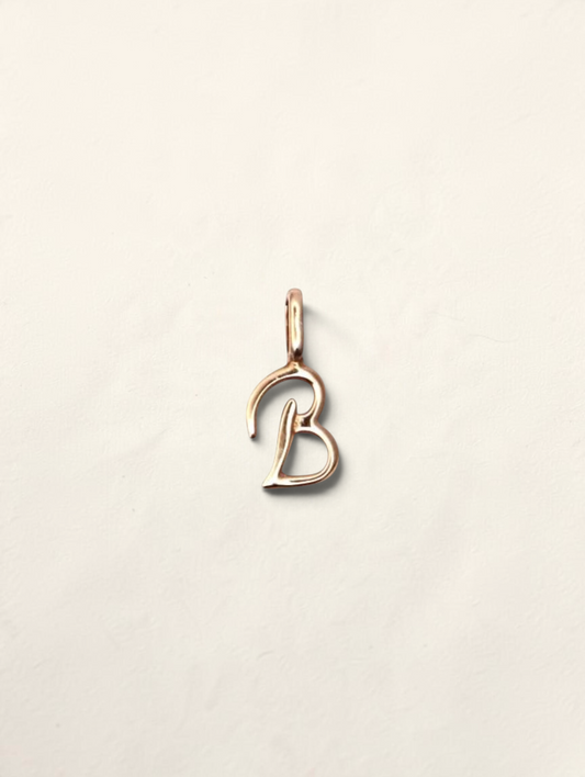 Zafrah 14K yellow gold initial B pendant with a polished finish on a neutral background