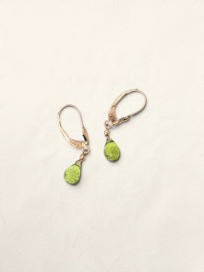 Zafrah 14k yellow gold huggie hoop earrings featuring faceted pear-shaped green quartz drops