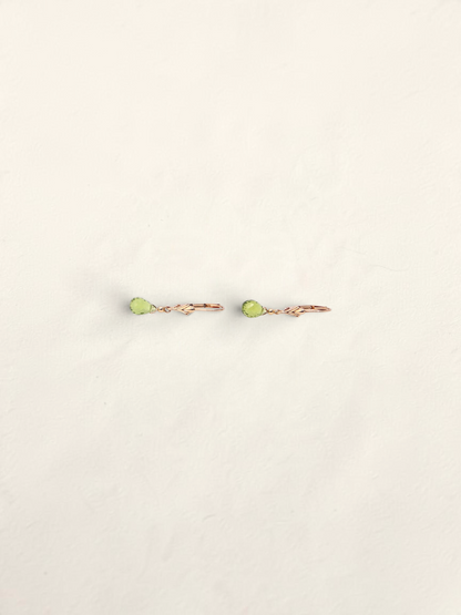 Zafrah 14k yellow gold huggie hoop earrings featuring delicate teardrop-shaped green quartz gemstones.
