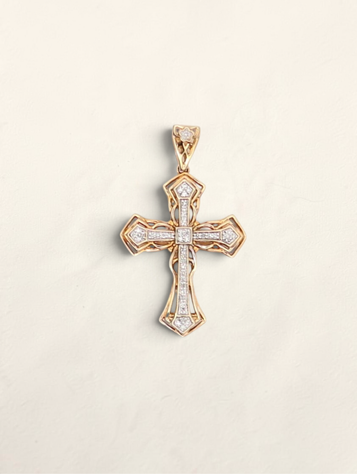 Zafrah 10k yellow gold cross pendant featuring 0.22ctw round diamonds in an intricate filigree design