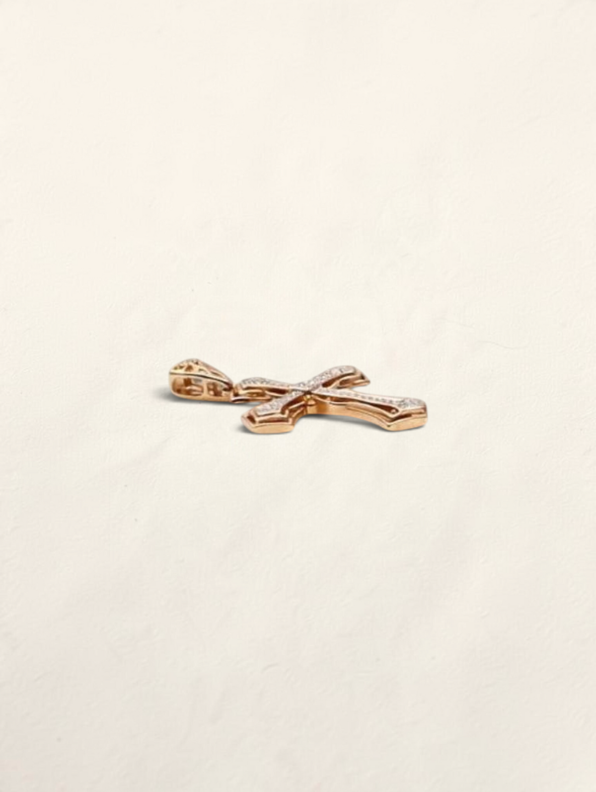 Zafrah 10k yellow gold cross pendant featuring 44 round diamonds set in a polished gold frame.