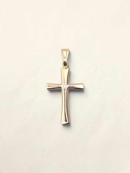 Zafrah 14k yellow gold cross pendant featuring a single round solitaire diamond at the center.