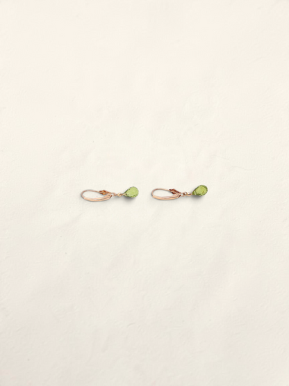Zafrah 14k yellow gold huggie hoop earrings featuring delicate teardrop-shaped green quartz gemstones