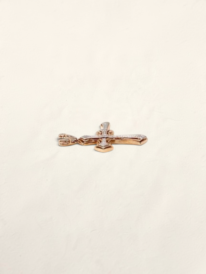 Zafrah 10k yellow gold cross pendant featuring 44 round diamonds totaling 0.22ctw, shown from a side angle.