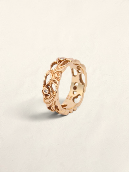 Zafrah 14K yellow gold filigree ring featuring five bezel-set round diamonds in an intricate openwork band design.