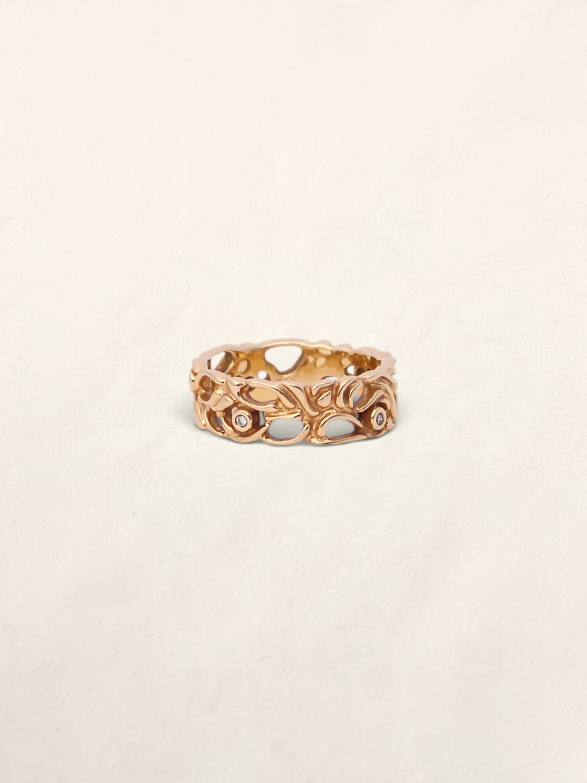 Zafrah 14K yellow gold filigree ring featuring five round bezel-set diamonds in an intricate openwork band design