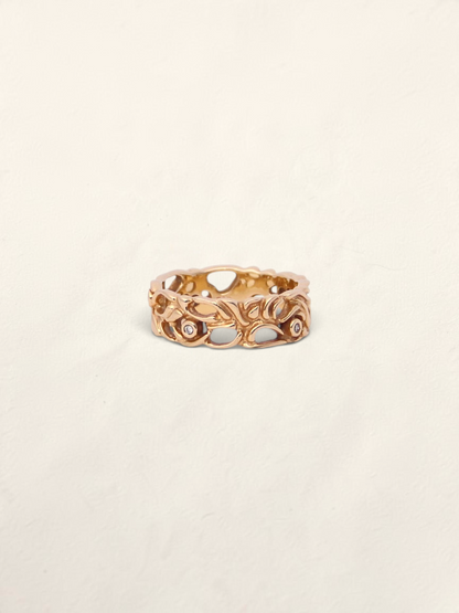 Zafrah 14K yellow gold filigree ring featuring five round bezel-set diamonds in an intricate openwork band design