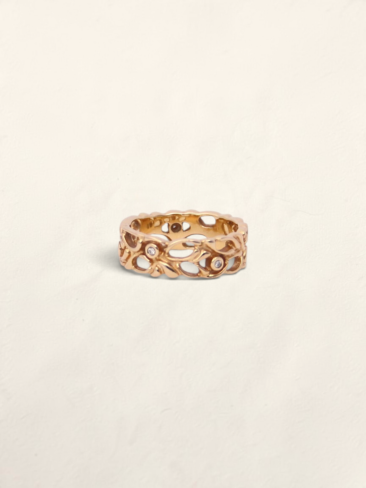 Zafrah 14K yellow gold filigree ring featuring five round bezel-set diamonds in an intricate openwork band design