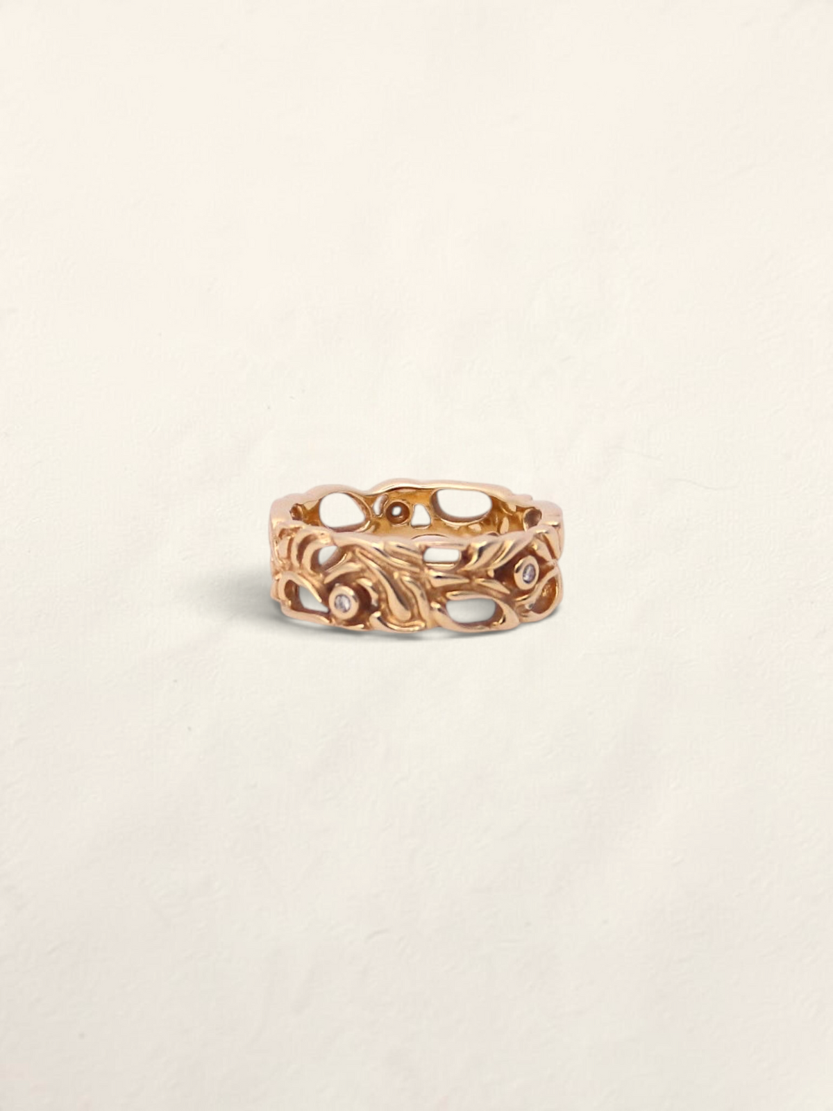 Zafrah 14k yellow gold filigree ring featuring five bezel-set round diamonds in an intricate openwork design.