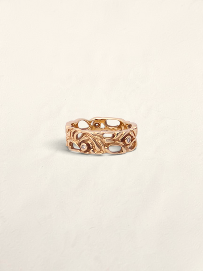 Zafrah 14k yellow gold filigree ring featuring five bezel-set round diamonds in an intricate openwork design.