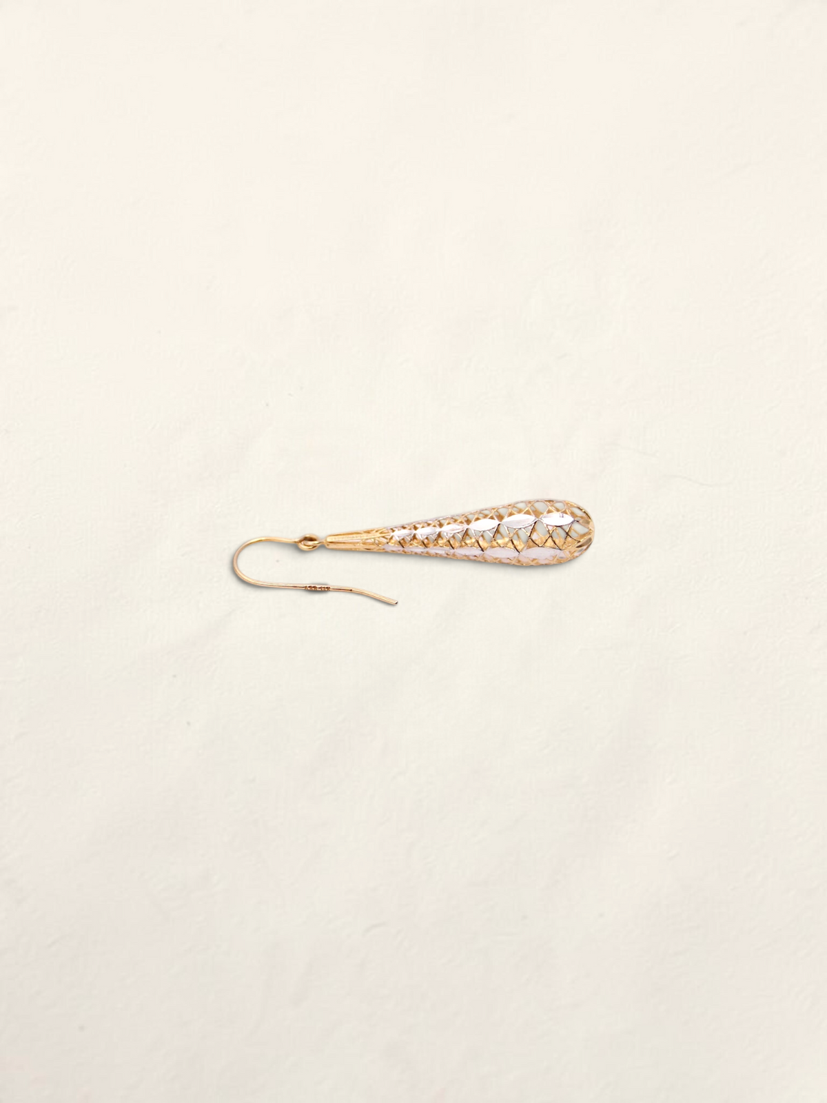 Zafrah 14K two-tone gold dropdown earrings featuring an intricate lattice design on a light background