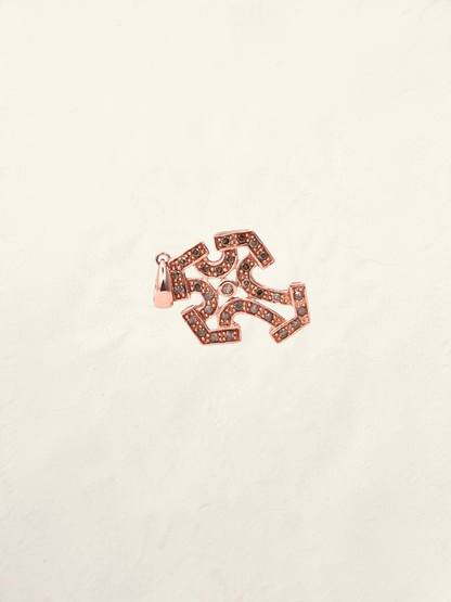 Zafrah 10k rose gold cross pendant featuring intricate filigree details and sparkling chocolate round diamonds.