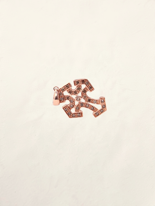 Zafrah 10k rose gold cross pendant featuring intricate filigree details and sparkling chocolate round diamonds.