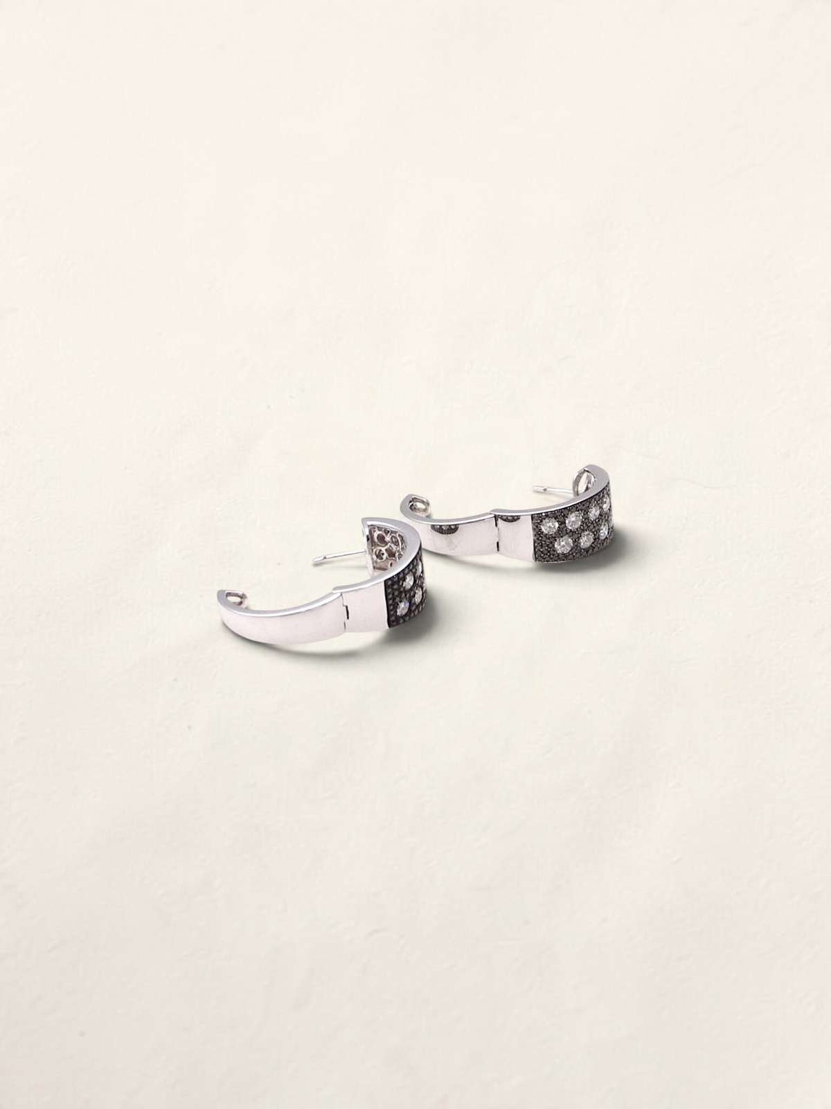 Zafrah 14K white gold huggie hoop earrings featuring a pave setting of round black and white diamonds