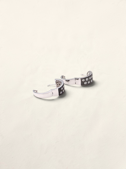 Zafrah 14K white gold huggie hoop earrings featuring a pave setting of round black and white diamonds