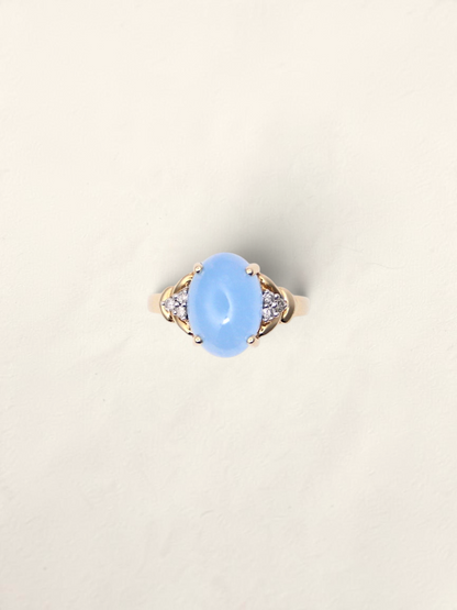 Zafrah 14K yellow gold ring featuring an oval blue jadeite stone accented by six round diamonds