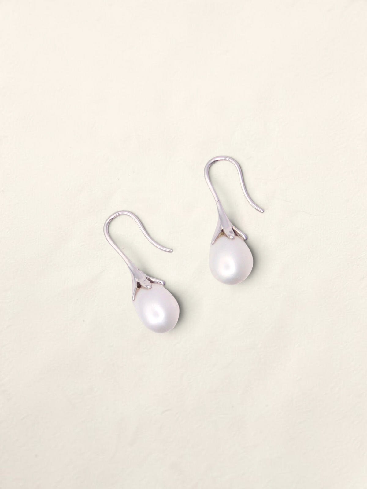 Zafrah 14k white gold drop earrings featuring elegant teardrop-shaped cultured pearls on curved hooks