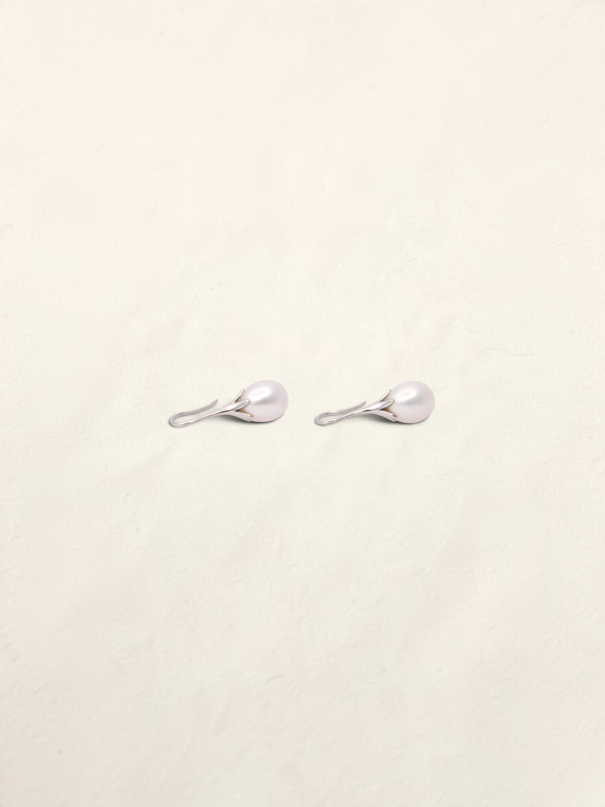 Zafrah 14K white gold drop earrings featuring elegant cultured pearls in a minimalist setting