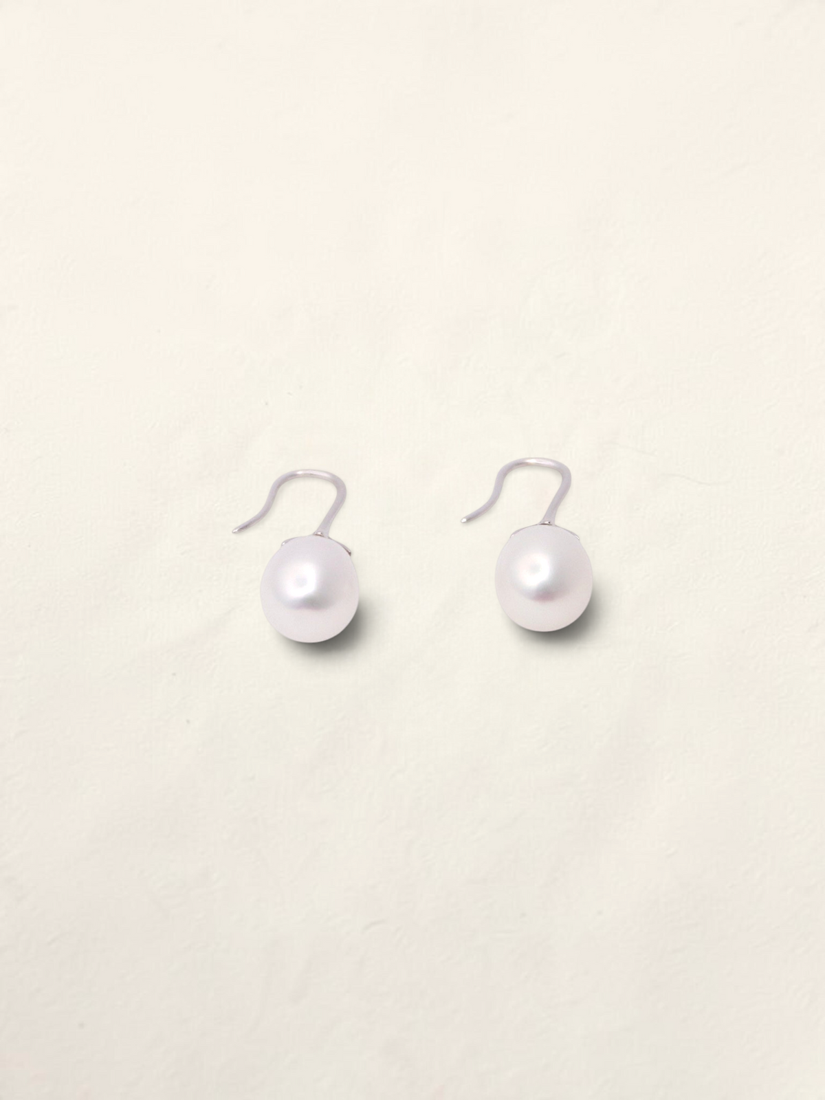 Zafrah 14K white gold drop earrings featuring lustrous white cultured pearls on elegant curved hooks