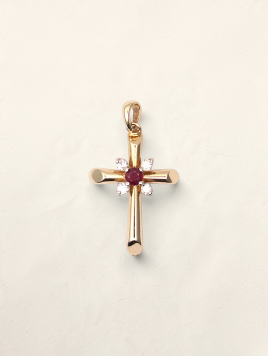 Zafrah 14K yellow gold cross pendant featuring a central round ruby surrounded by four sparkling round diamonds.