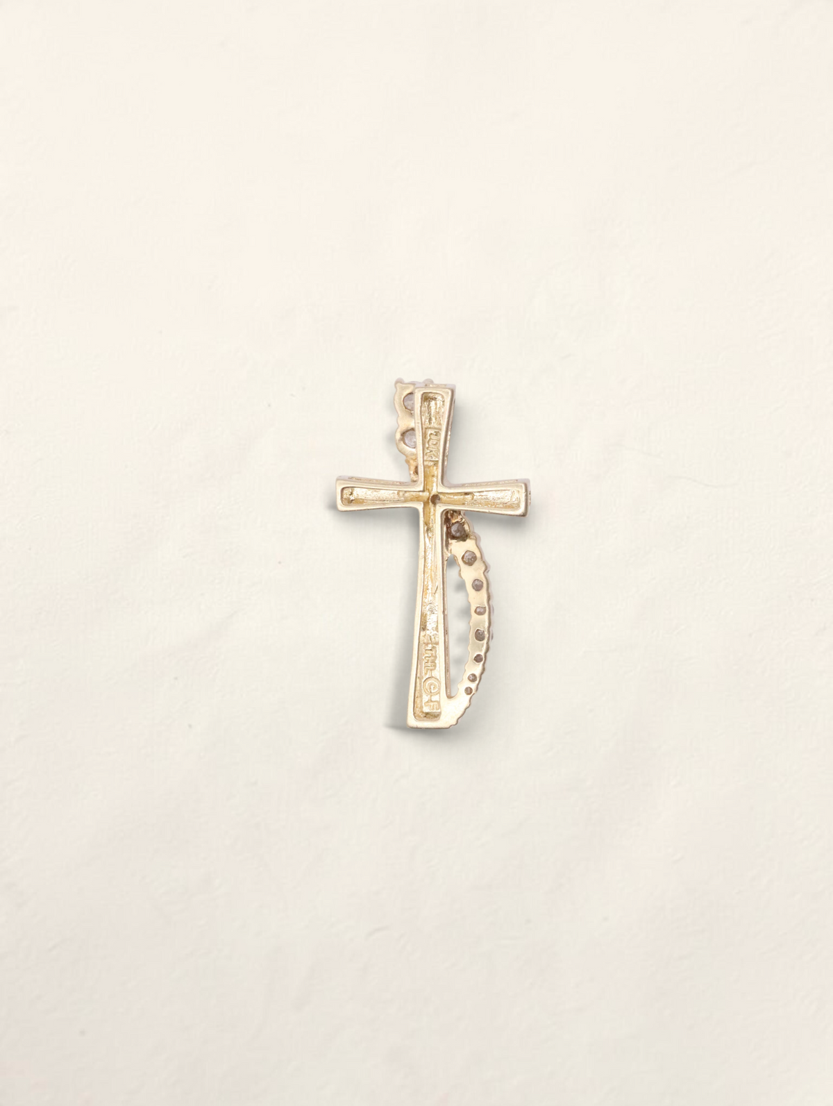 Zafrah 10k yellow gold cross pendant featuring graduated round diamonds totaling 0.21ctw on a white background.