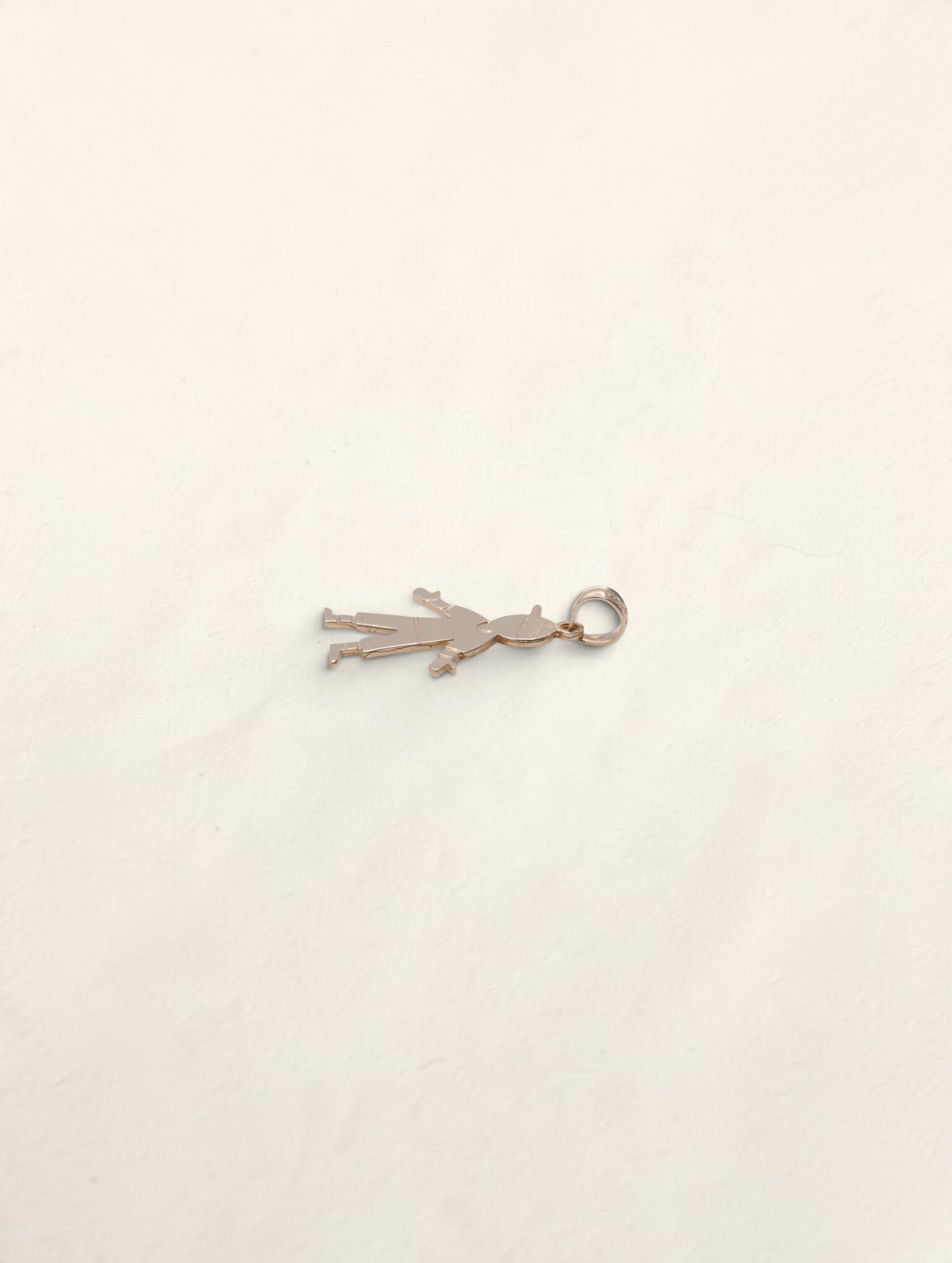 Zafrah 14K yellow gold boy pendant charm with a polished finish, shown from a side angle on a white background.