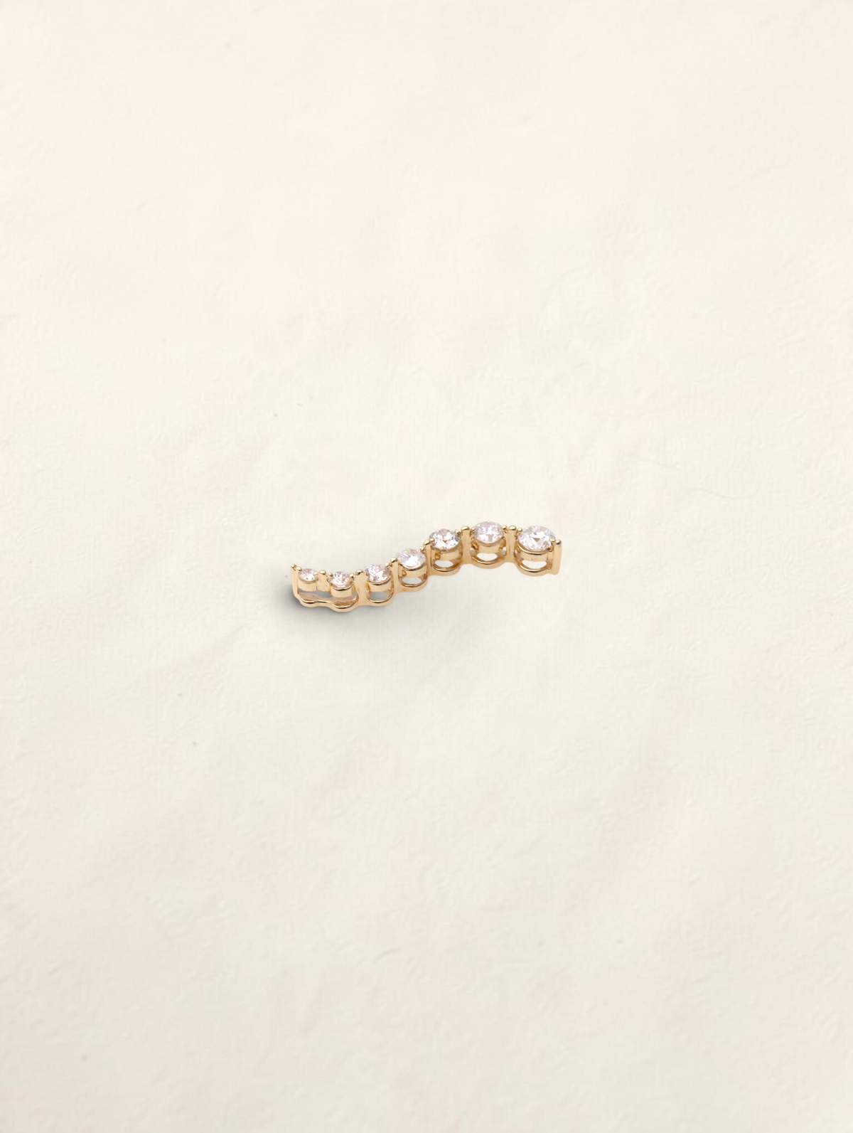 Zafrah 14K yellow gold curved journey pendant featuring seven graduated round diamonds totaling 0.5ctw