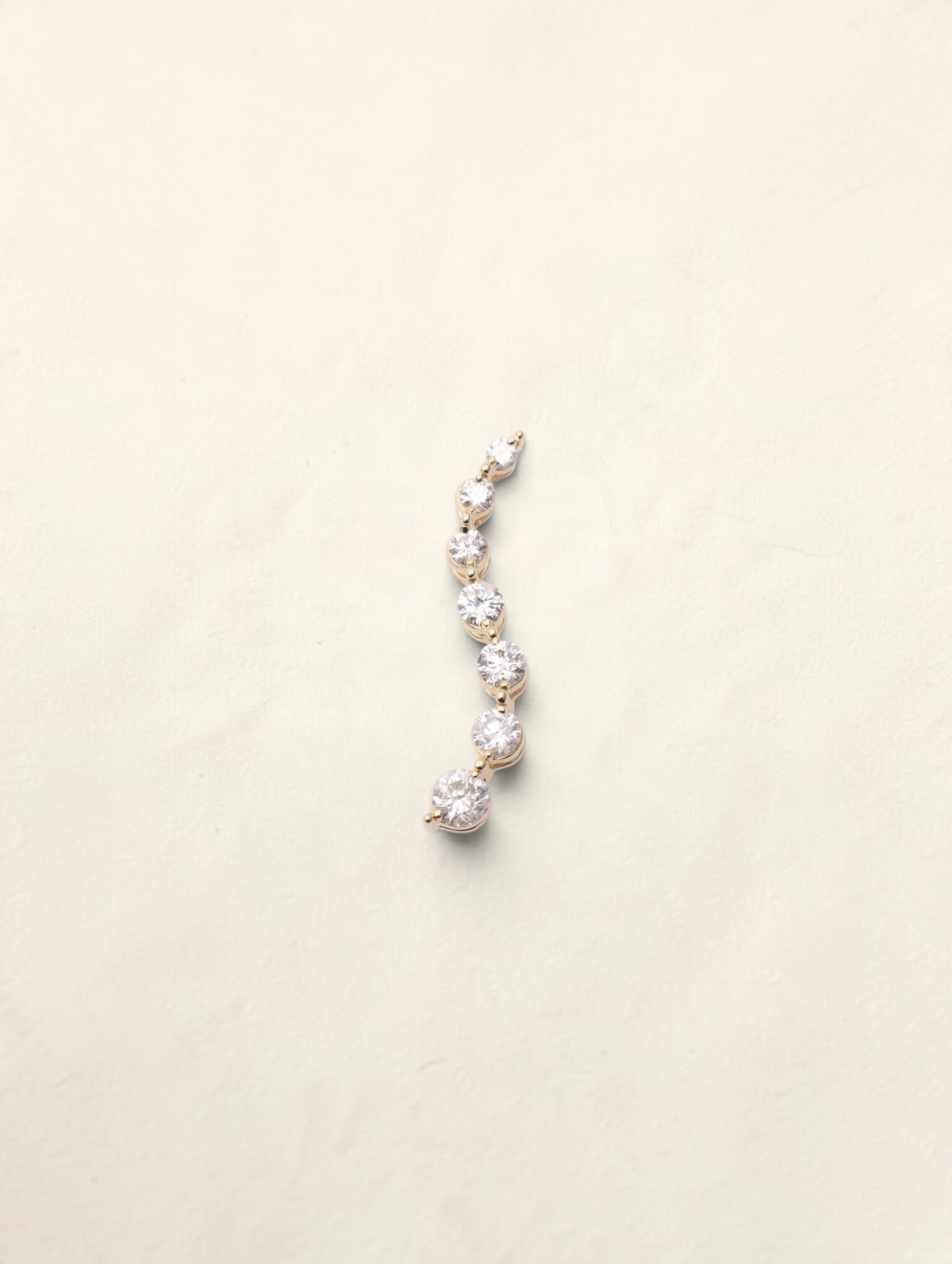 Zafrah 14k yellow gold curved journey pendant featuring seven graduated round diamonds totaling 0.5ctw