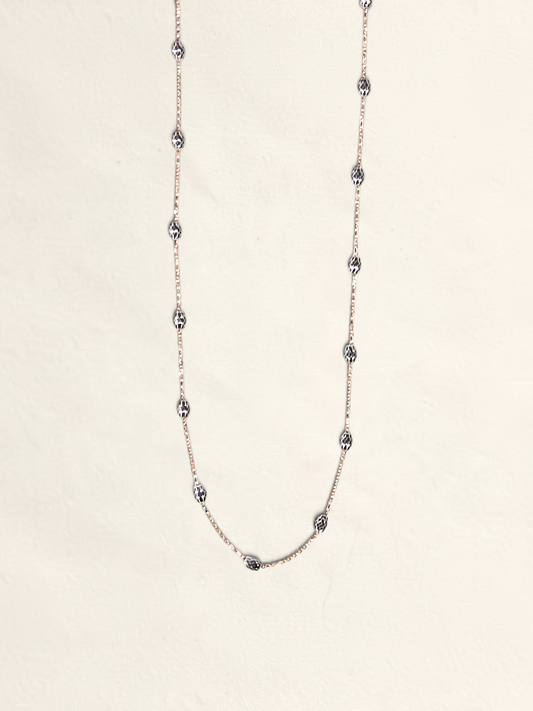 Zafrah 16-inch 14K two-tone gold necklace featuring textured Saturn beads on a delicate chain